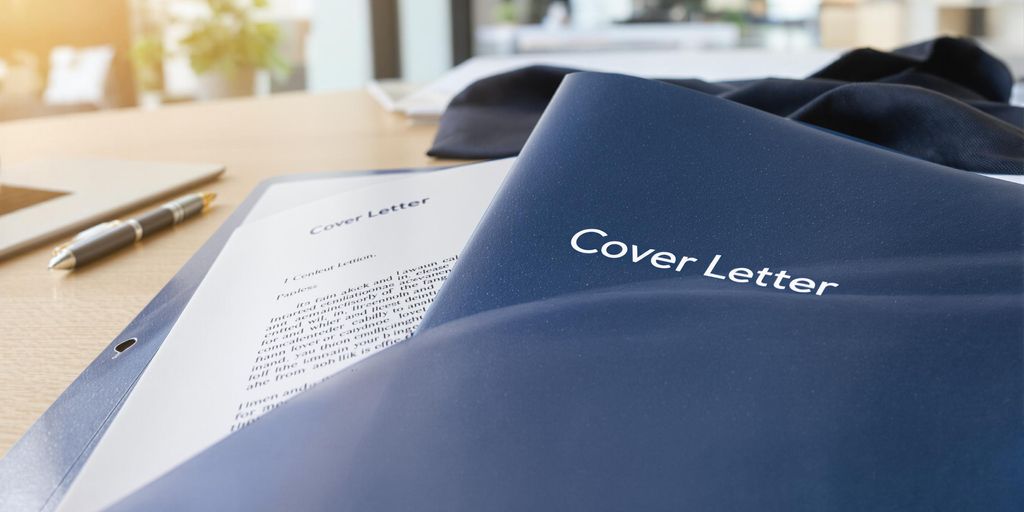 Folder with cover letter and pen on office desk