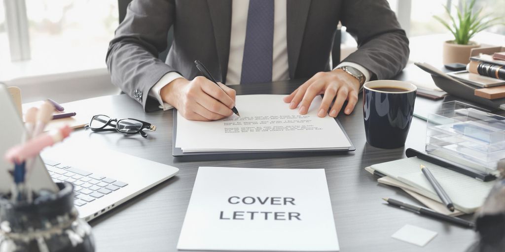 Person writing cover letter at tidy office desk
