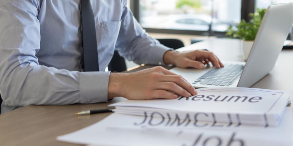 Person reviewing documents at modern office desk