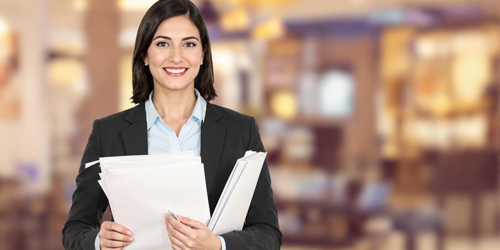 Paralegal holding legal documents.