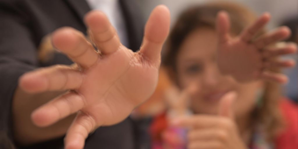 Strong hands reaching for more powerful verbs.