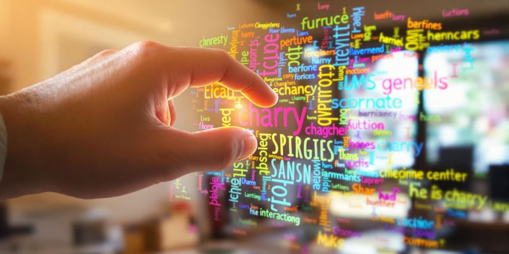Person choosing words from a vibrant word cloud