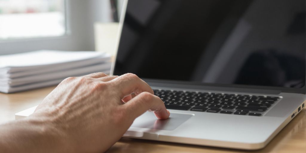 Open laptop with a well-crafted cover letter.