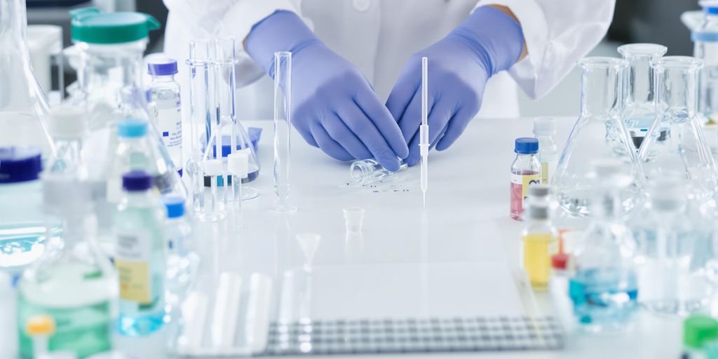 Person organizing laboratory equipment.