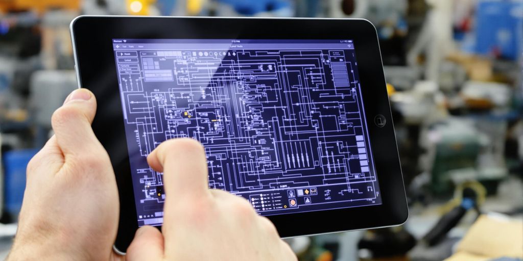 Controls engineer holding a tablet.