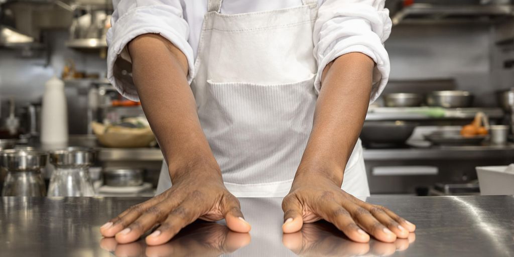 Chef in kitchen, professional, calm focus